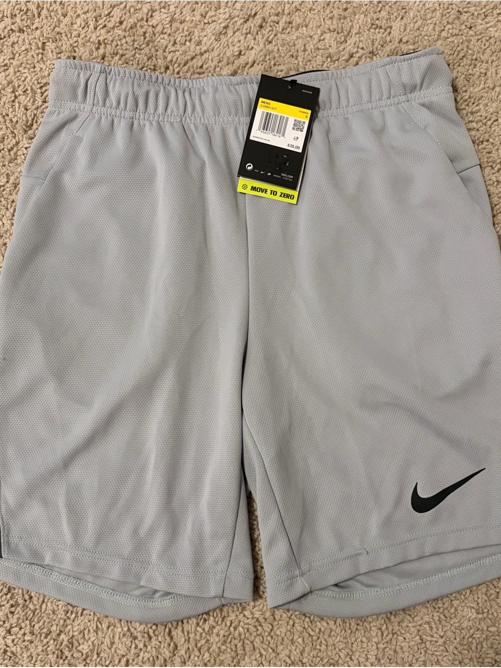 Nike Men’s Light Gray Athletic Shorts with Black Swoosh size small
